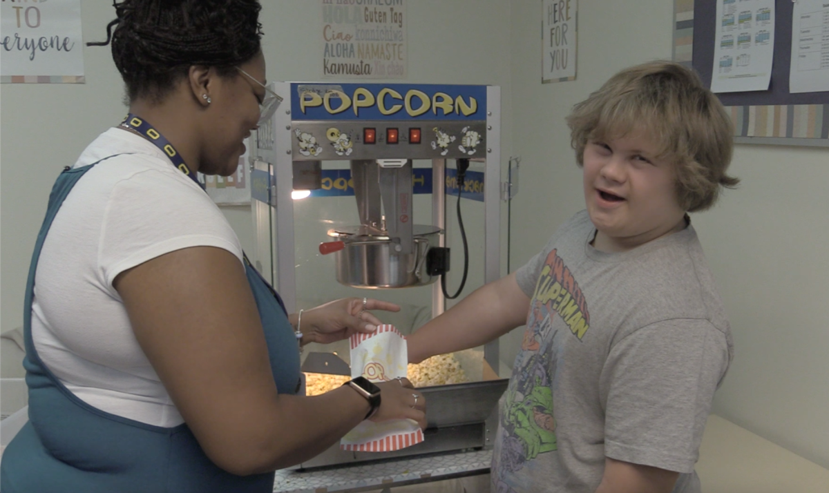 Nicholas Drummond has fun while making popcorn.